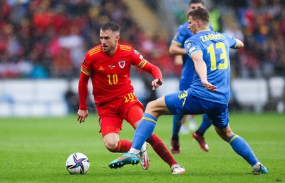 050622 -  Wales v Ukraine, World Cup Qualifying Play Off Final -Aaron Ramsey of Wales takes on Illia Zabarnyi of Ukraine