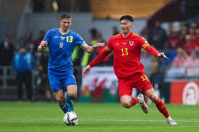 050622 -  Wales v Ukraine, World Cup Qualifying Play Off Final -Kieffer Moore of Wales and Illia Zabarnyi of Ukraine compete for the ball