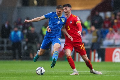 050622 -  Wales v Ukraine, World Cup Qualifying Play Off Final -Kieffer Moore of Wales and Illia Zabarnyi of Ukraine compete for the ball