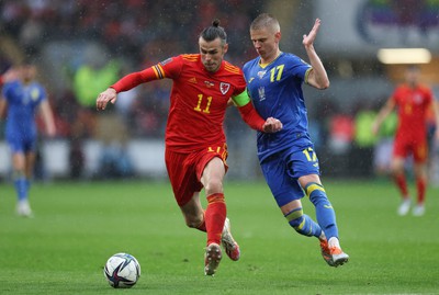 050622 -  Wales v Ukraine, World Cup Qualifying Play Off Final - Gareth Bale of Wales holds off Oleksandr Zinchenko of Ukraine