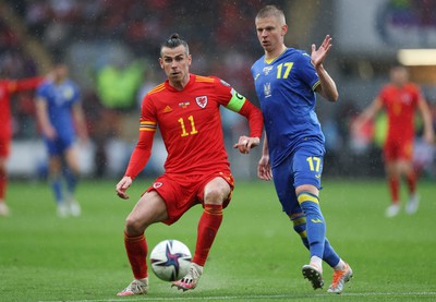 050622 -  Wales v Ukraine, World Cup Qualifying Play Off Final - Gareth Bale of Wales holds off Oleksandr Zinchenko of Ukraine