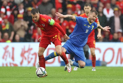 050622 -  Wales v Ukraine, World Cup Qualifying Play Off Final - Aaron Ramsey of Wales wins the ball from Andriy Yarmolenko of Ukraine