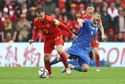 050622 -  Wales v Ukraine, World Cup Qualifying Play Off Final - Aaron Ramsey of Wales wins the ball from Andriy Yarmolenko of Ukraine