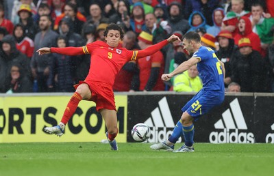 050622 -  Wales v Ukraine, World Cup Qualifying Play Off Final - Brennan Johnson of Wales looks to challenge Oleksandr Karavaev of Ukraine