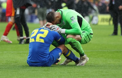 050622 -  Wales v Ukraine, World Cup Qualifying Play Off Final - Mykola Matviyenko of Ukraine in consoled by goalkeeper Georgiy Bushchan of Ukraine as Wales reach the World Cup Finals