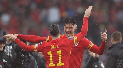 050622 -  Wales v Ukraine, World Cup Qualifying Play Off Final - Kieffer Moore of Wales and Gareth Bale of Wales celebrate at the end of the match