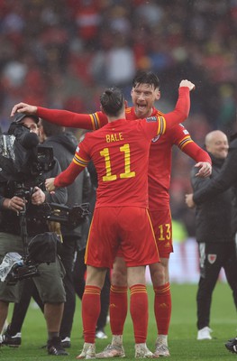 050622 -  Wales v Ukraine, World Cup Qualifying Play Off Final - Kieffer Moore of Wales and Gareth Bale of Wales celebrate at the end of the match