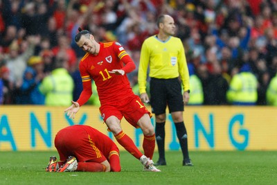 050622 -  Wales v Ukraine, World Cup Qualifying Play Off Final - Gareth Bale of Wales celebrates after the final whistle with Aaron Ramsey of Wales (on floor)