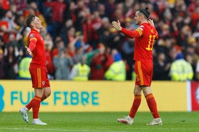 050622 -  Wales v Ukraine, World Cup Qualifying Play Off Final - Gareth Bale and Connor Roberts of Wales celebrate after the final whistle