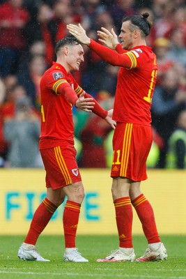 050622 -  Wales v Ukraine, World Cup Qualifying Play Off Final - Gareth Bale and Connor Roberts of Wales celebrate after the final whistle