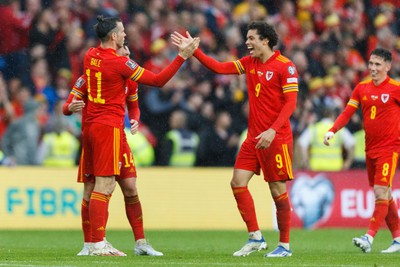 050622 -  Wales v Ukraine, World Cup Qualifying Play Off Final - Gareth Bale and Brennan Davies celebrate after the final whistle