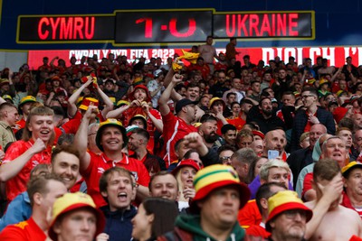 050622 -  Wales v Ukraine, World Cup Qualifying Play Off Final - Wales fans and supporters celebrate after the final whistle