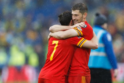 050622 -  Wales v Ukraine, World Cup Qualifying Play Off Final - Joe Allen and Ben Davies of Wales celebrate after the final whistle