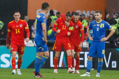 050622 -  Wales v Ukraine, World Cup Qualifying Play Off Final - Gareth Bale celebrates with Aaron Ramsey of Wales after they score a goal