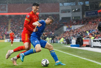 050622 -  Wales v Ukraine, World Cup Qualifying Play Off Final - Kieffer Moore of Wales and Illia Zabarnyi of Ukraine battle for the ball