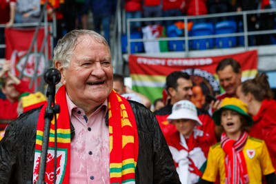 050622 -  Wales v Ukraine, World Cup Qualifying Play Off Final - Dafydd Iwan waits to sing Yma o Hyd as it starts to rain