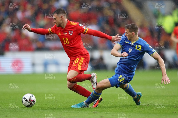 050622 -  Wales v Ukraine, World Cup Qualifying Play Off Final - Aaron Ramsey of Wales is challenged by Illia Zabarnyi of Ukraine