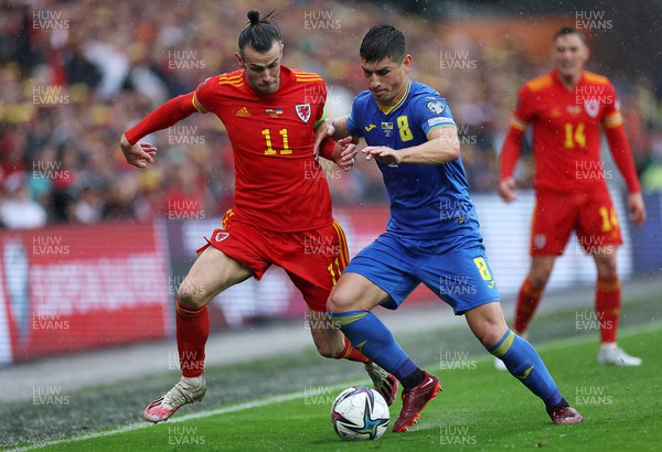 050622 -  Wales v Ukraine, World Cup Qualifying Play Off Final - Gareth Bale of Wales is challenged by Ruslan Malinovskyi of Ukraine