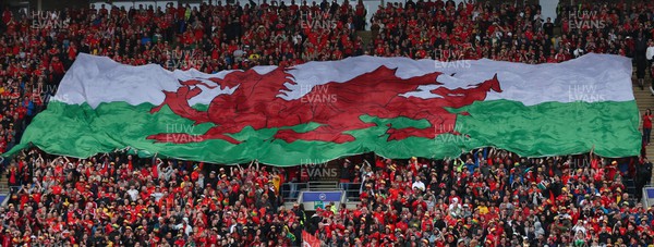 050622 -  Wales v Ukraine, World Cup Qualifying Play Off Final - A giant Welsh flag is passed up the stand ahead of the match
