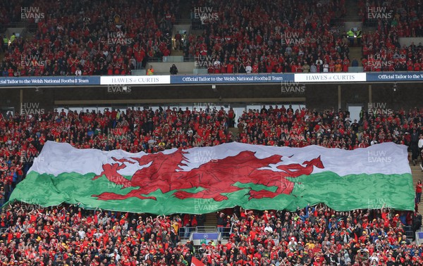 050622 -  Wales v Ukraine, World Cup Qualifying Play Off Final - A giant Welsh flag is passed up the stand ahead of the match