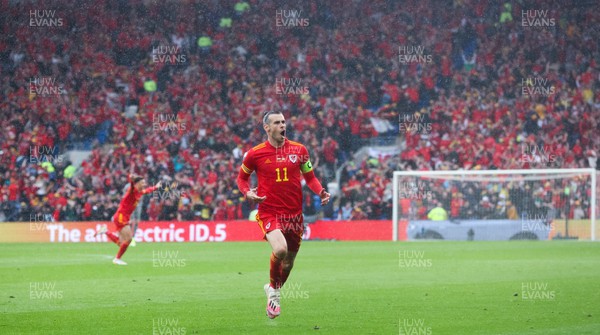 050622 -  Wales v Ukraine, World Cup Qualifying Play Off Final - Gareth Bale of Wales celebrates after his free kick is deflected into the Ukraine net to score goal