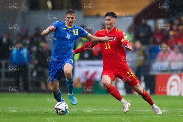 050622 -  Wales v Ukraine, World Cup Qualifying Play Off Final -Kieffer Moore of Wales and Illia Zabarnyi of Ukraine compete for the ball