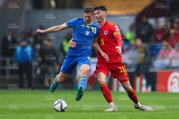 050622 -  Wales v Ukraine, World Cup Qualifying Play Off Final -Kieffer Moore of Wales and Illia Zabarnyi of Ukraine compete for the ball