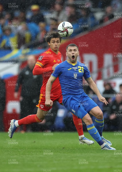 050622 -  Wales v Ukraine, World Cup Qualifying Play Off Final - Oleksandr Karavaev of Ukraine has his eyes on the ball as Brennan Johnson of Wales closes in