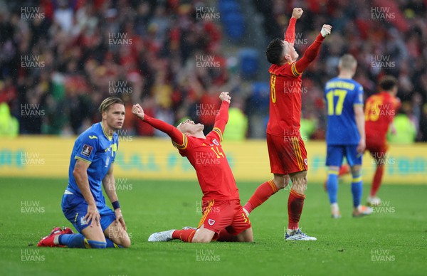 050622 -  Wales v Ukraine, World Cup Qualifying Play Off Final - Connor Roberts of Wales celebrates on the final whistle as Mykhailo Mudryk of Ukraine shows the dejection