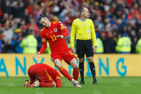 050622 -  Wales v Ukraine, World Cup Qualifying Play Off Final - Gareth Bale of Wales celebrates after the final whistle with Aaron Ramsey of Wales (on floor)