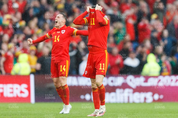 050622 -  Wales v Ukraine, World Cup Qualifying Play Off Final - Gareth Bale (face covered) and Connor Roberts of Wales celebrates after the final whistle
