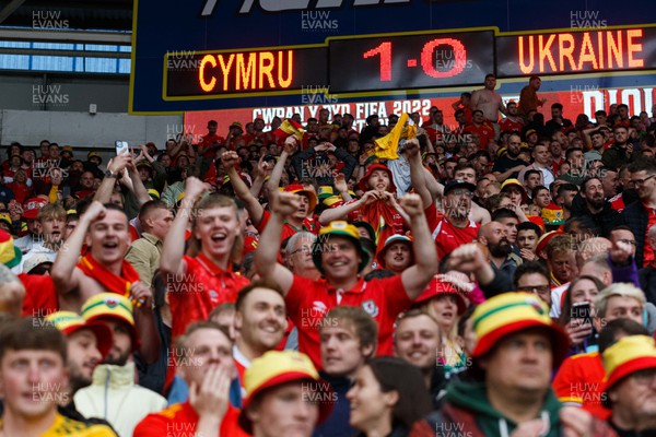 050622 -  Wales v Ukraine, World Cup Qualifying Play Off Final - Wales fans and supporters celebrate after the final whistle