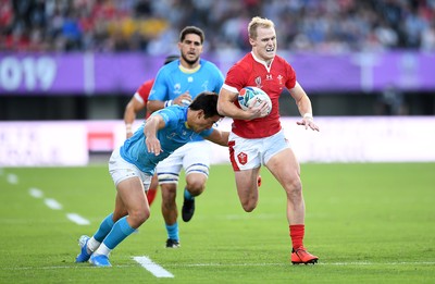 131019 - Wales v Uruguay - Rugby World Cup - Pool D - Aled Davies of Wales is tackled by Juan Manuel Cat of Uruguay