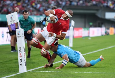 131019 - Wales v Uruguay - Rugby World Cup - Pool D - Aaron Shingler of Wales is pushed into touch by Nicolas Freitas of Uruguay