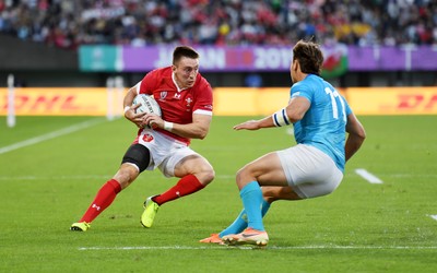 131019 - Wales v Uruguay - Rugby World Cup - Pool D - Josh Adams of Wales is challenged by Nicolas Freitas of Uruguay