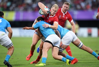 131019 - Wales v Uruguay - Rugby World Cup - Pool D - Aled Davies of Wales is tackled by Juan Manuel Gaminara and Santiago Civetta of Uruguay