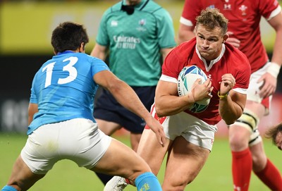 131019 - Wales v Uruguay - Rugby World Cup - Pool D - Hallam Amos of Wales is tackled by Juan Manuel Cat of Uruguay