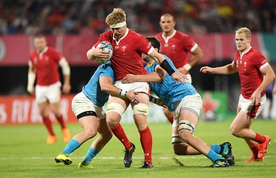 131019 - Wales v Uruguay - Rugby World Cup - Pool D - Aaron Wainwright of Wales is tackled by Juan Manuel Gaminara and Ignacio Dotti of Uruguay