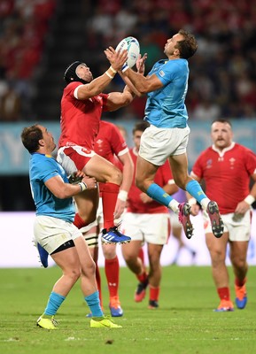 131019 - Wales v Uruguay - Rugby World Cup - Pool D - Leigh Halfpenny of Wales and Gaston Mieres of Uruguay go up for the high ball