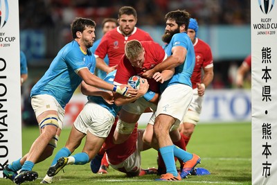 131019 - Wales v Uruguay - Rugby World Cup - Pool D - Bradley Davies of Wales is tackled just before the try line by Santiago Arata and Diego Arbelo of Uruguay