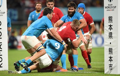 131019 - Wales v Uruguay - Rugby World Cup - Pool D - Bradley Davies of Wales is tackled just before the try line by Santiago Arata and Diego Arbelo of Uruguay