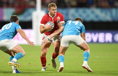 131019 - Wales v Uruguay - Rugby World Cup - Pool D - Hallam Amos of Wales is tackled by Leandro Leivas of Uruguay