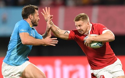 131019 - Wales v Uruguay - Rugby World Cup - Pool D - James Davies of Wales is tackled by Felipe Berchesi of Uruguay