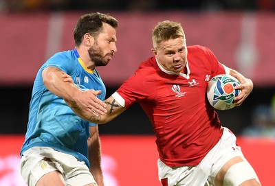 131019 - Wales v Uruguay - Rugby World Cup - Pool D - James Davies of Wales is tackled by Felipe Berchesi of Uruguay