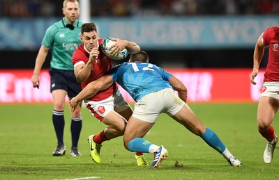 131019 - Wales v Uruguay - Rugby World Cup - Pool D - Tomos Williams of Wales is tackled by Andres Vilaseca of Uruguay