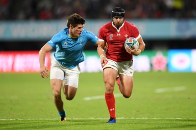 131019 - Wales v Uruguay - Rugby World Cup - Pool D - Leigh Halfpenny of Wales is tackled by Tomas Inciarte of Uruguay