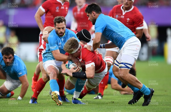 131019 - Wales v Uruguay - Rugby World Cup - Pool D - Aaron Wainwright of Wales is tackled by Felipe Berchesi and Alejandro Nieto of Uruguay