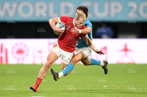 131019 - Wales v Uruguay - Rugby World Cup - Pool D - Aled Davies of Wales is tackled by Santiago Arata of Uruguay