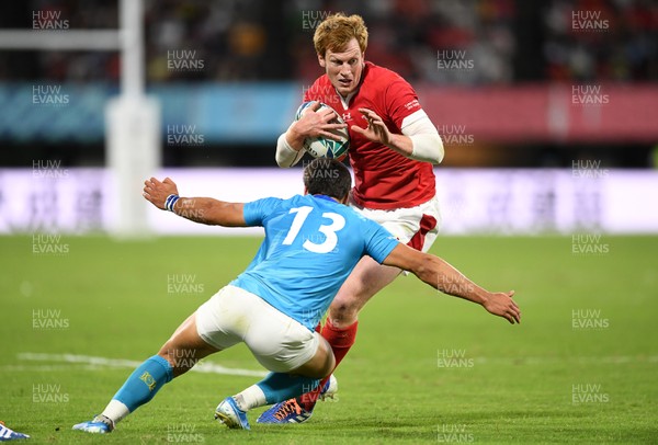 131019 - Wales v Uruguay - Rugby World Cup - Pool D - Rhys Patchell of Wales is tackled by Juan Manuel Cat of Uruguay