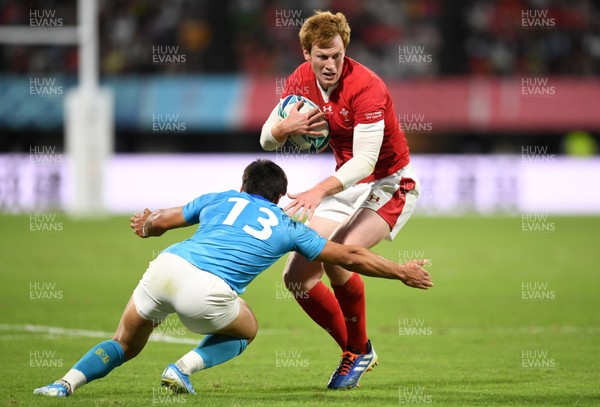131019 - Wales v Uruguay - Rugby World Cup - Pool D - Rhys Patchell of Wales is tackled by Juan Manuel Cat of Uruguay